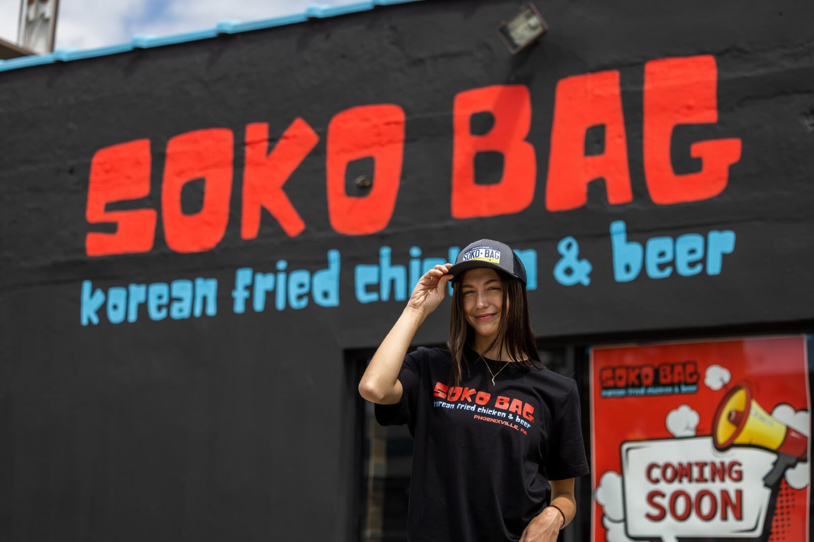 Soko Bag Restaurant with a girl smiling in soko bag clothes